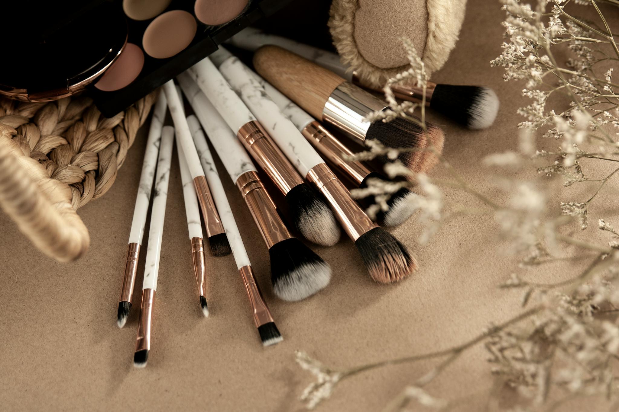 A stylish flat lay of makeup brushes and cosmetics for beauty enthusiasts.